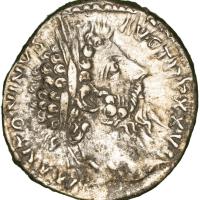 The face of an ancient coin.